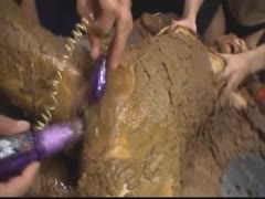 Slut got masturbated with sex toys while buried on shit